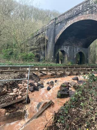 One of the flood damaged sites on the Tarka Line, between Crediton and Exeter, one of nine sites washed out as a result of flooding from the River Creedy. Credit: NDLRPG