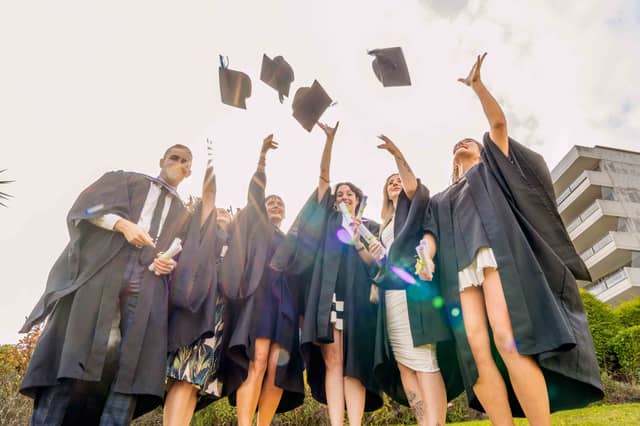 2024 University Centre South Devon graduates celebrate collecting their degrees.