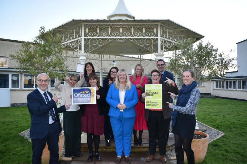 Torquay Girls Grammar School head Sarah Forster (centre) and staff celebrate the inspection success