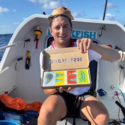 Rex Fisher aboard 'Rockfisher 2' with the Christmas gift from Rockfish