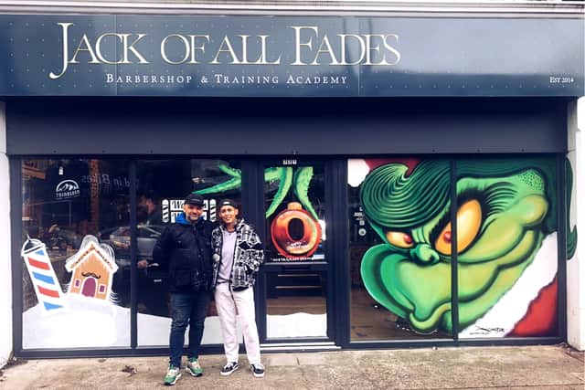 The instigator of this spontaneous trail of street art with a commission of the Grinch with a mullet was Josie Jackson, owner of the barbershop Jack of all Fades.