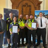 New powers - Cllr David Thomas (left) with Inspector Rob Harvey (right) and some of the Torbay Council staff who have been granted additional powers.