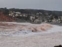 File picture: Storm waves crashing onto the pebbled beach at Budleigh Salterton in Devon during a previous storm  