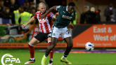 Aribim Pepple of Plymouth Argyle challenges for the ball with Pierce Sweeney of Exeter City during the Sky Bet League Match between Exeter City and Plymouth Argyle at St James Park, Devon on 23rd Oct 