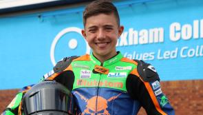 Teenage biker Ralph racing to the top