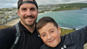 Roman, 9, walks tall in marathon fund-raising trek