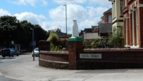 Paignton's iconic milk bottle stands though big tree falls