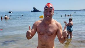 Swimmers battle jellyfish and blazing heat in record-breaking Torbay Swim