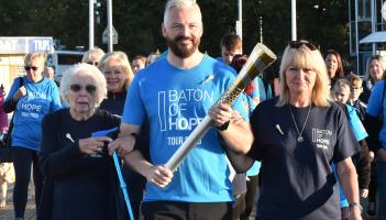 Chris Hallett leads the Baton of Hope relay on Torquay seafront All pictures miraclePR.com.