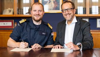 College principal Laurence Frewin and BRNC's Capt Andrew Bray sign the agreement