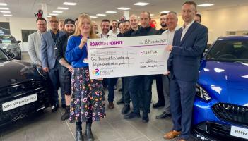 head of business Gareth Watton and the Ocean BMW team with the Rowcroft cheque