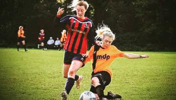 Emma Quaintance getting stuck in for Plainmoor Ladies
