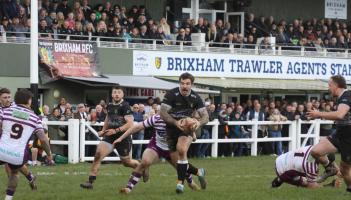 Packed stands at Astley Park for Devon Final