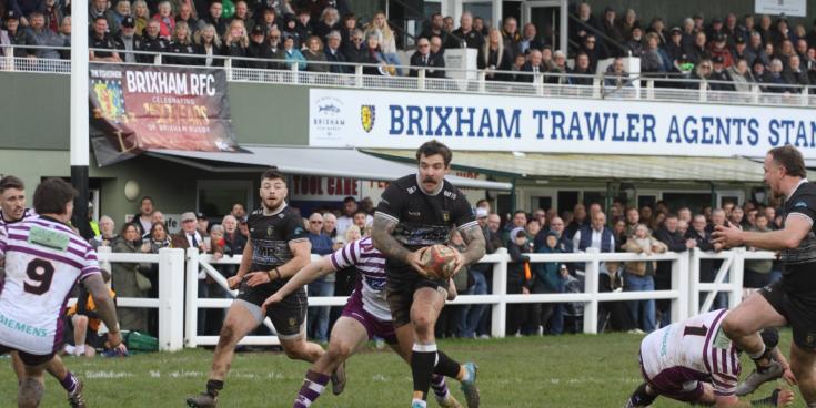 Packed stands at Astley Park for Devon Final