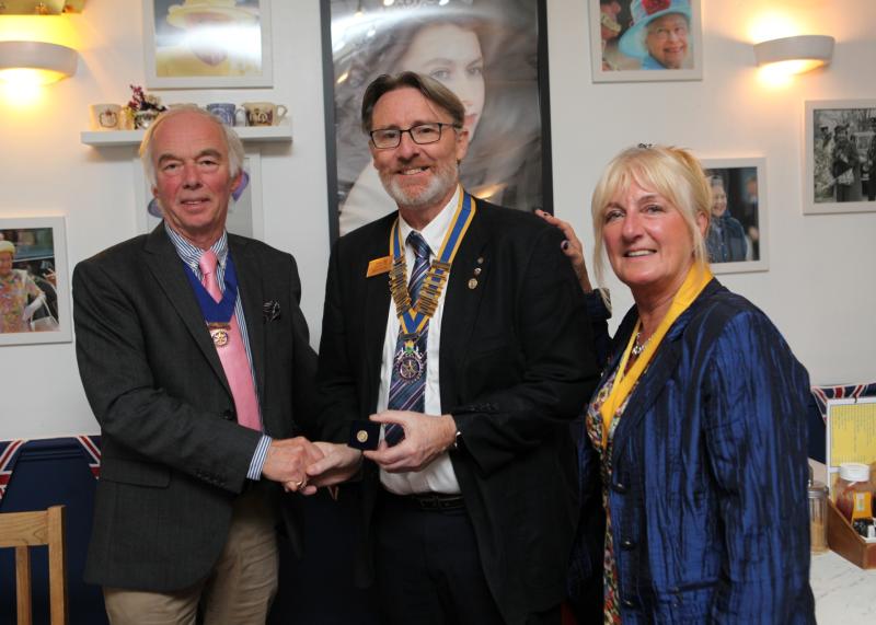 Andy wife and fellow Rotarian Kathy receives his award from Steve Holdup 