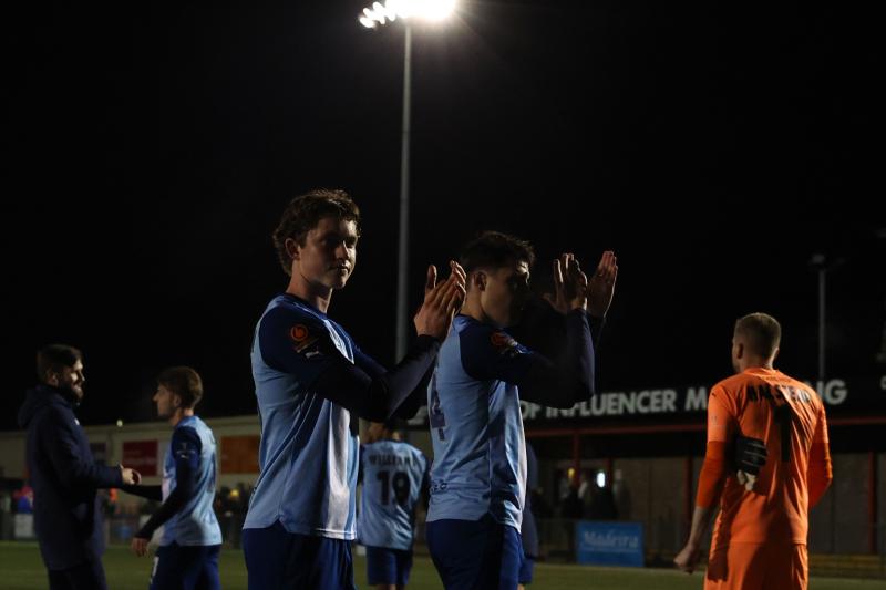 Torquay players applaud the fans