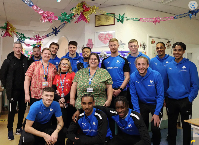 The United squad and staff on the Louisa Cary ward