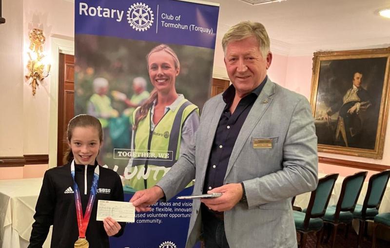 Gary Phare presents the Tormohun Rotary cheque to Willow-Mae Calland