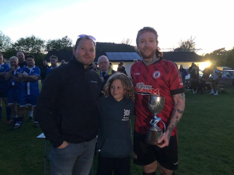 Bovey Tracey captain Ryan Stanbridge presented the Lidstone Cup by sponsors Barney Bettesworth