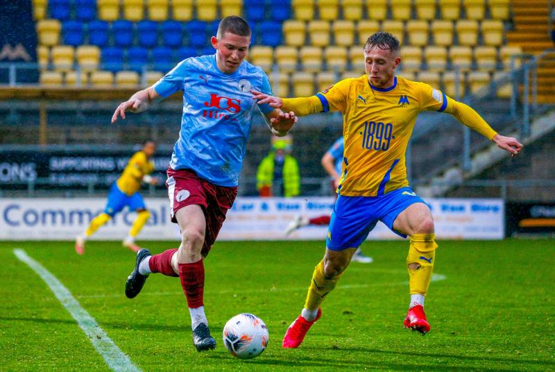Hasani playing against Torquay in 2022