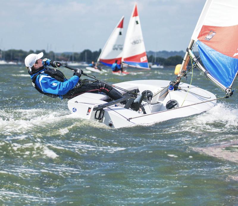Tom sailing in Poole
