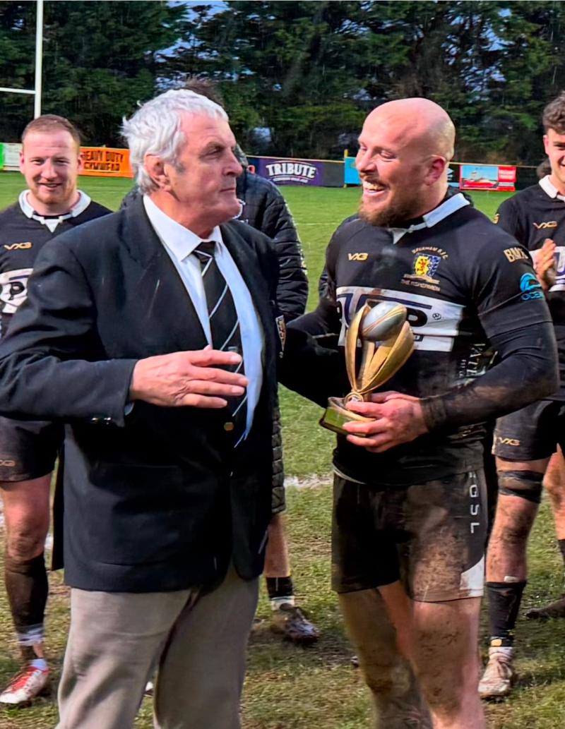 Brixham president Keith Gardner presents Matt Crossecombe with award