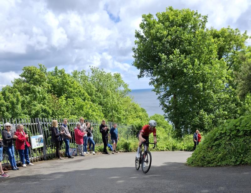 A rider tackles one of Oddicombe Hill's hairpins in the 2024 Totnes-Vire Stage Race
