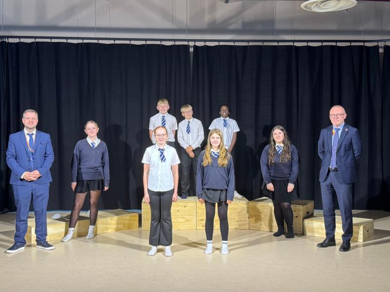 Graeme Hardman (L), Head of Music and Drama, and Mark Eager (R), Principal at Brixham College with Performing Arts pupils (Photo credit: Thinking Schools Academy Trust)