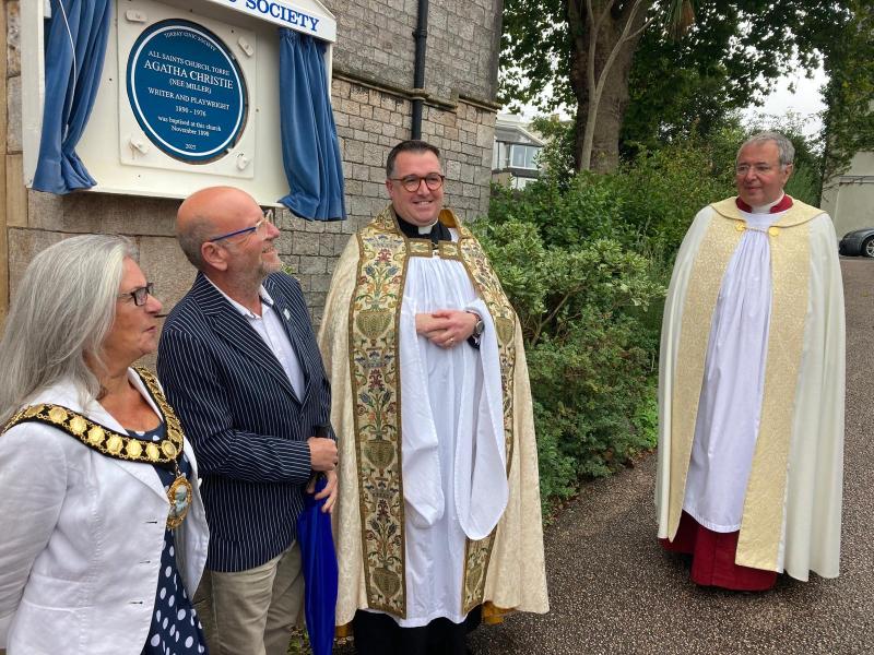 Unveiling the blue plaque is mayor Barbara Lewis, Agatha Christie Festival director Matt Newbury, All Saints vicar the Rev Peter March and Dean of Exeter Cathedral, the Very Rev Jonathan Greener