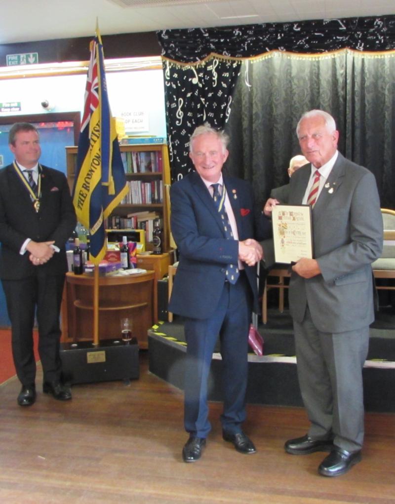 Rear Admiral (rtd) Christopher Snow, President of Devon County RBL, presents Maj Ron Goodwin with his life membership