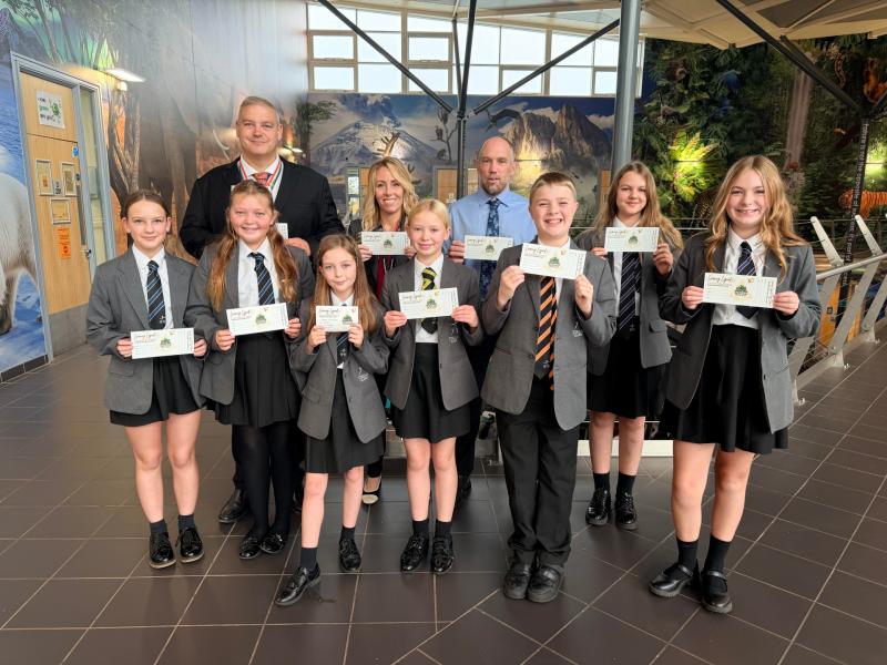 Torquay Academy project Steve Margetts, Thersa Pappin  and Ben Chadwick with students holding their ‘Learning Legends’ vouchers.