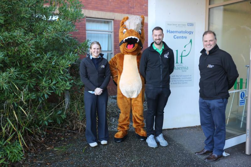 Exeter Racecourse mascot delivers Christmas gifts to children&rsquo;s ward after charity raceday