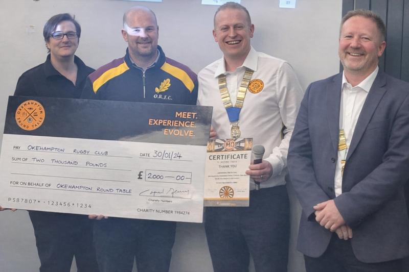Okehampton District Round Table members present a donation to Okehampton Rugby Club (Image- ODRT)