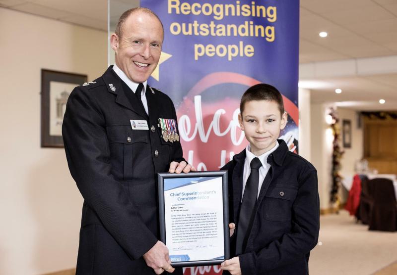 South Devon Police Commander Roy Linden presenting a commendation to Arthur Good (D&C Police)