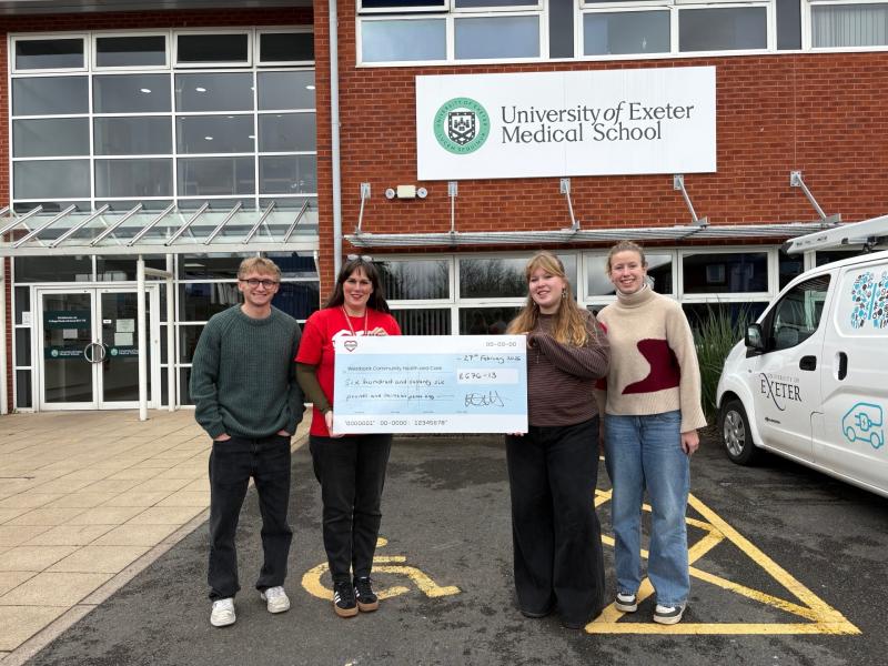 Westbank&rsquo;s Katie Elliott (in red T-shirt) being presented with a cheque by students at Exeter Medical School