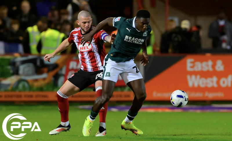 Aribim Pepple of Plymouth Argyle challenges for the ball with Pierce Sweeney of Exeter City during the Sky Bet League Match between Exeter City and Plymouth Argyle at St James Park, Devon on 23rd Oct 