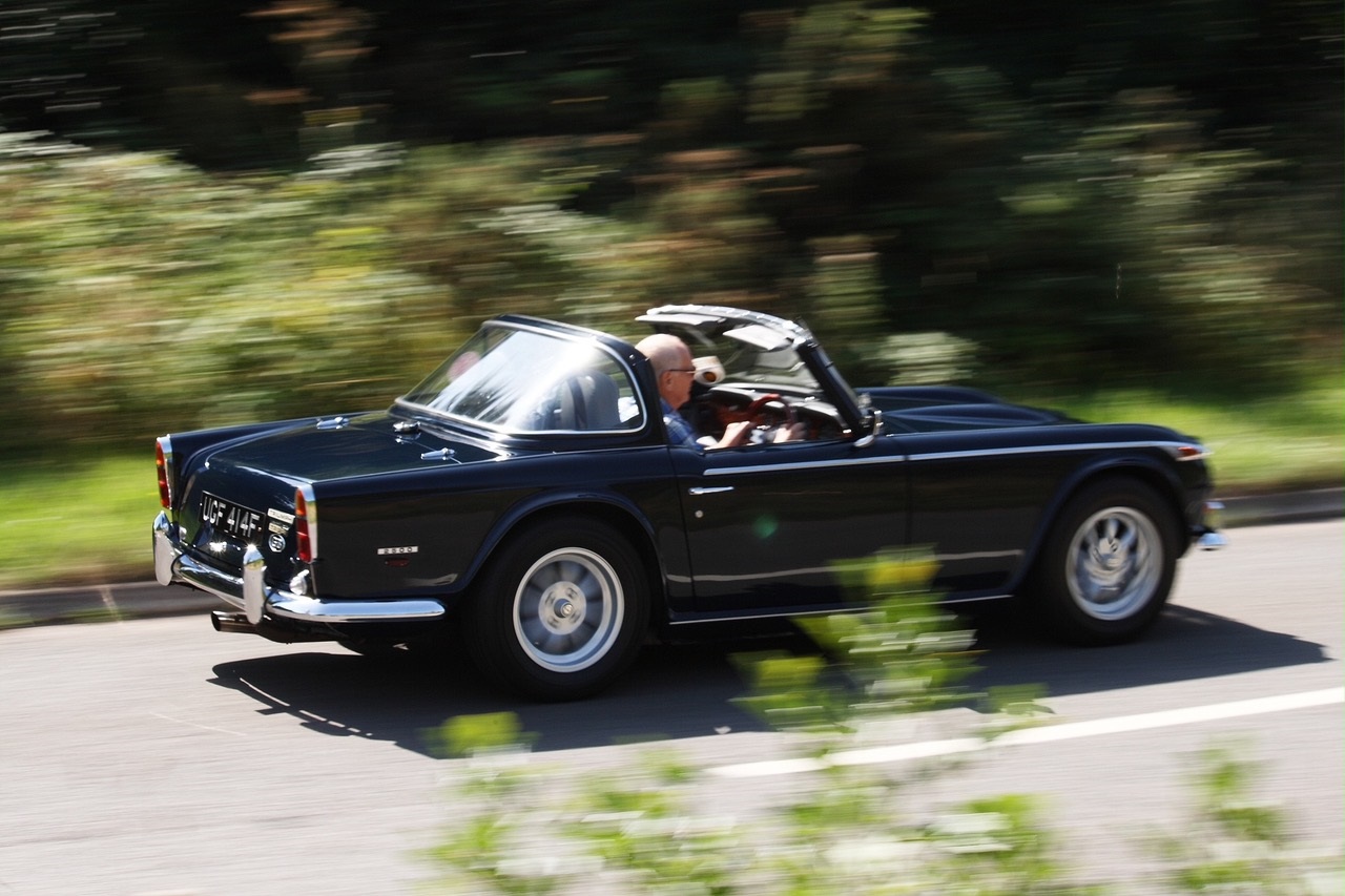 Crash Box member Dennis Hobbs driving his 1968 Triumph TR5 which he has owned for over 50 years.