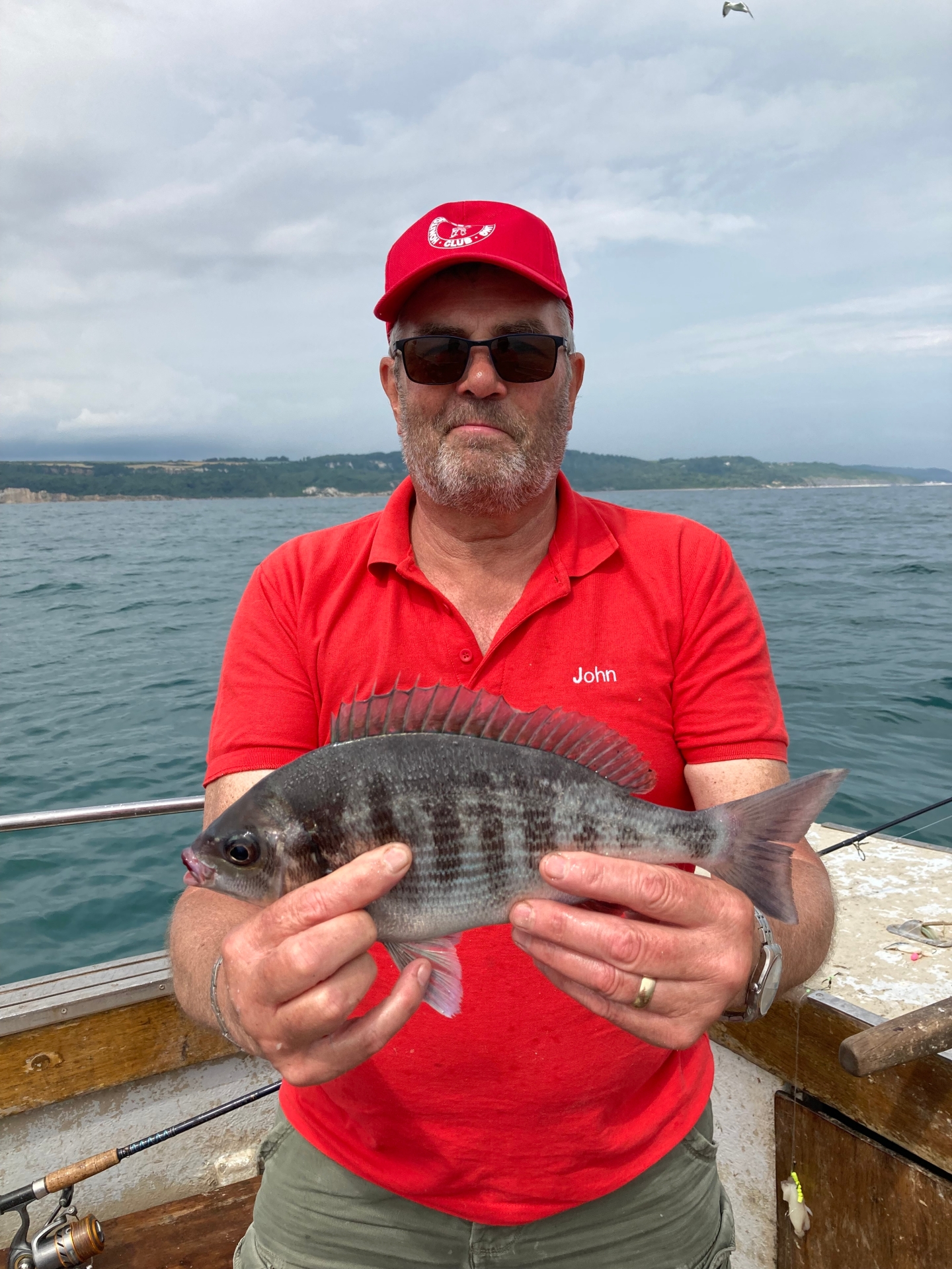 John Sherlock with a black bream