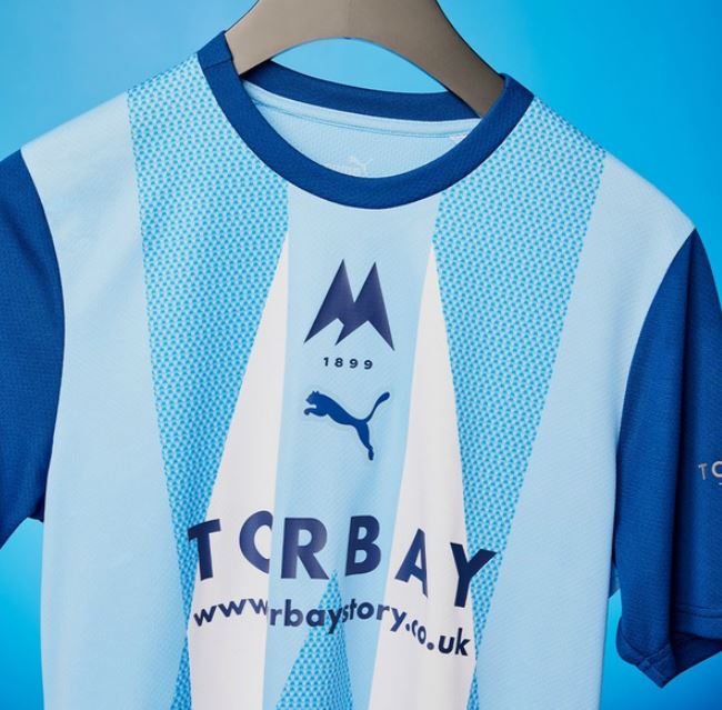 Torquay United's away shirt features the Torbay Story logo