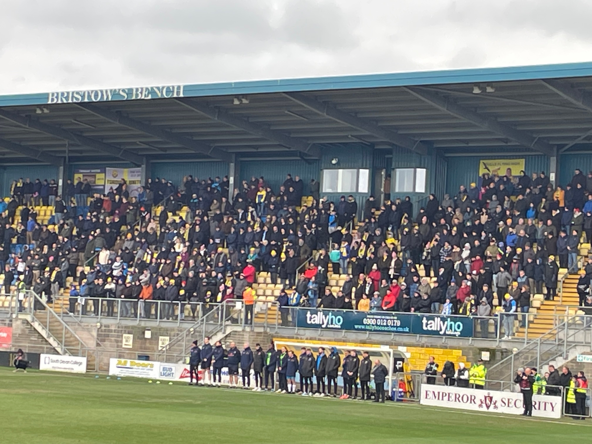 Torquay United fans in Bristow's Bench pay tribute
