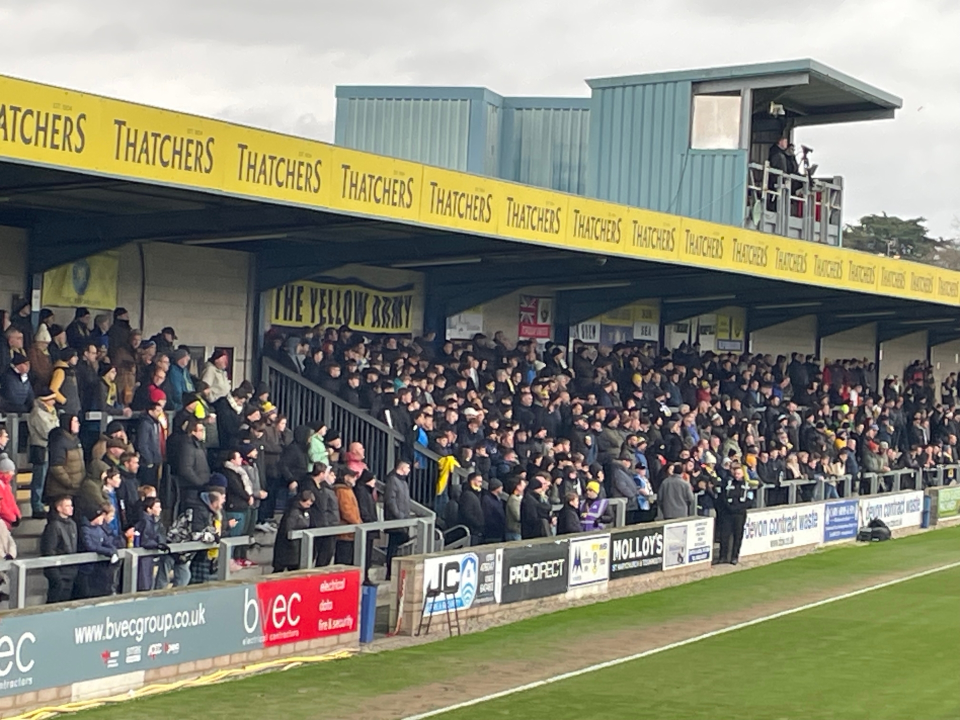 Torquay United fans on the Popular side pay tribute