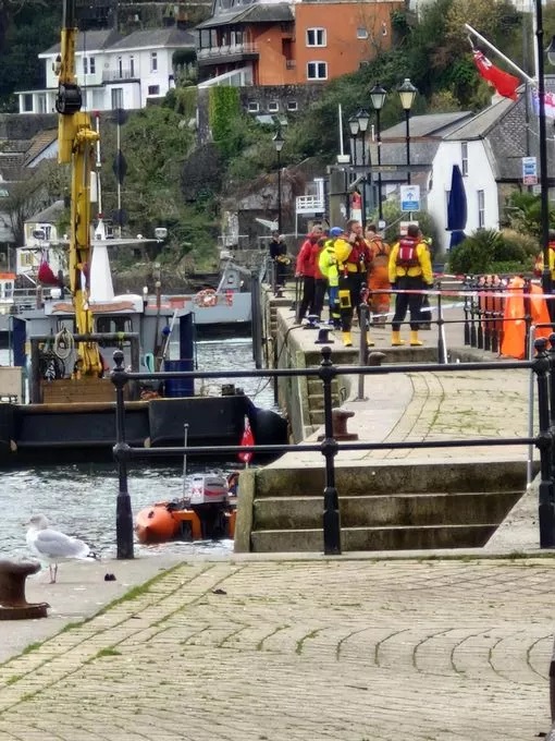 Divers and a crane at the scene in Dartmouth today Pic Janet Kidson