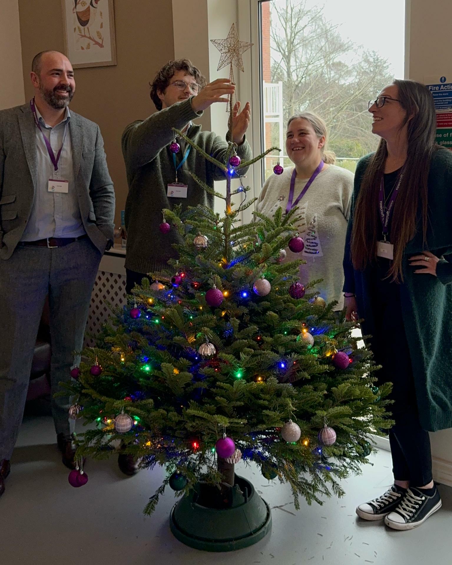 Staff from Orestone Wealth Management decorate tree at Rowcroft Hospice 