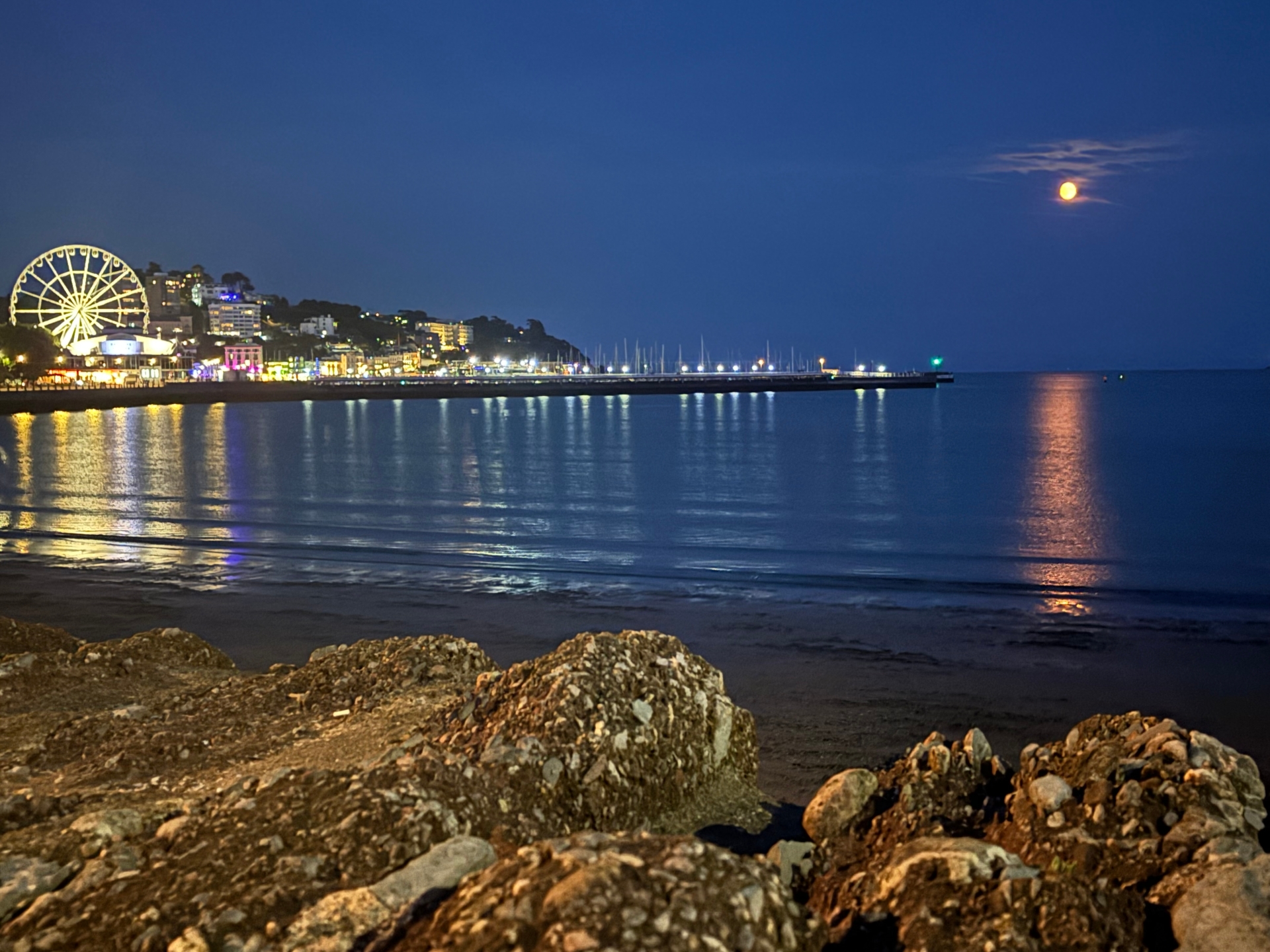 Orange moon and bright lights over Torquay Pic Jim Parker