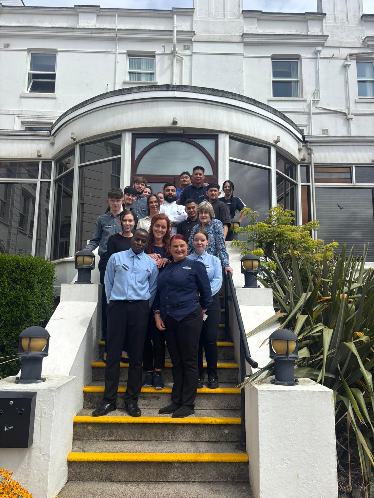 Palace Hotel 100 staff and guests on steps