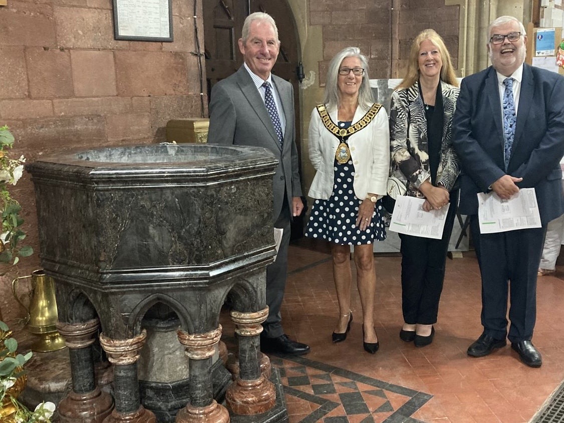 Mayoral consort Chris Lewis, mayor Barbara Lewis and councillors Jackie and Dave Thomas at the font of the Christie church