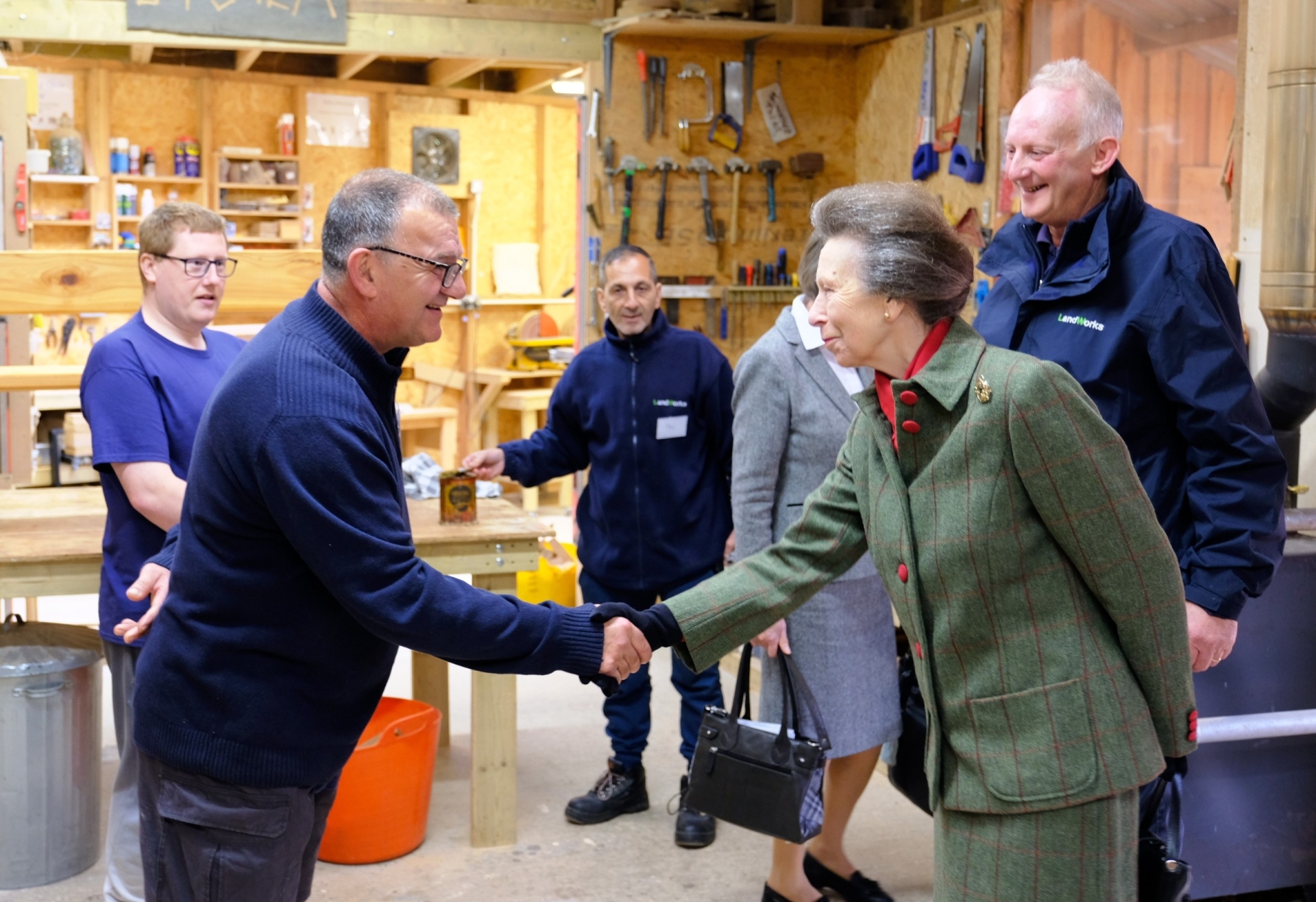 Princess Anne meets staff and trainees at the wood workshop of Landworks