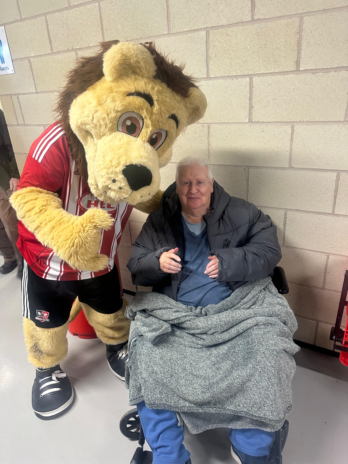Bob Rackley with the Exeter City mascot Grecian the Lion