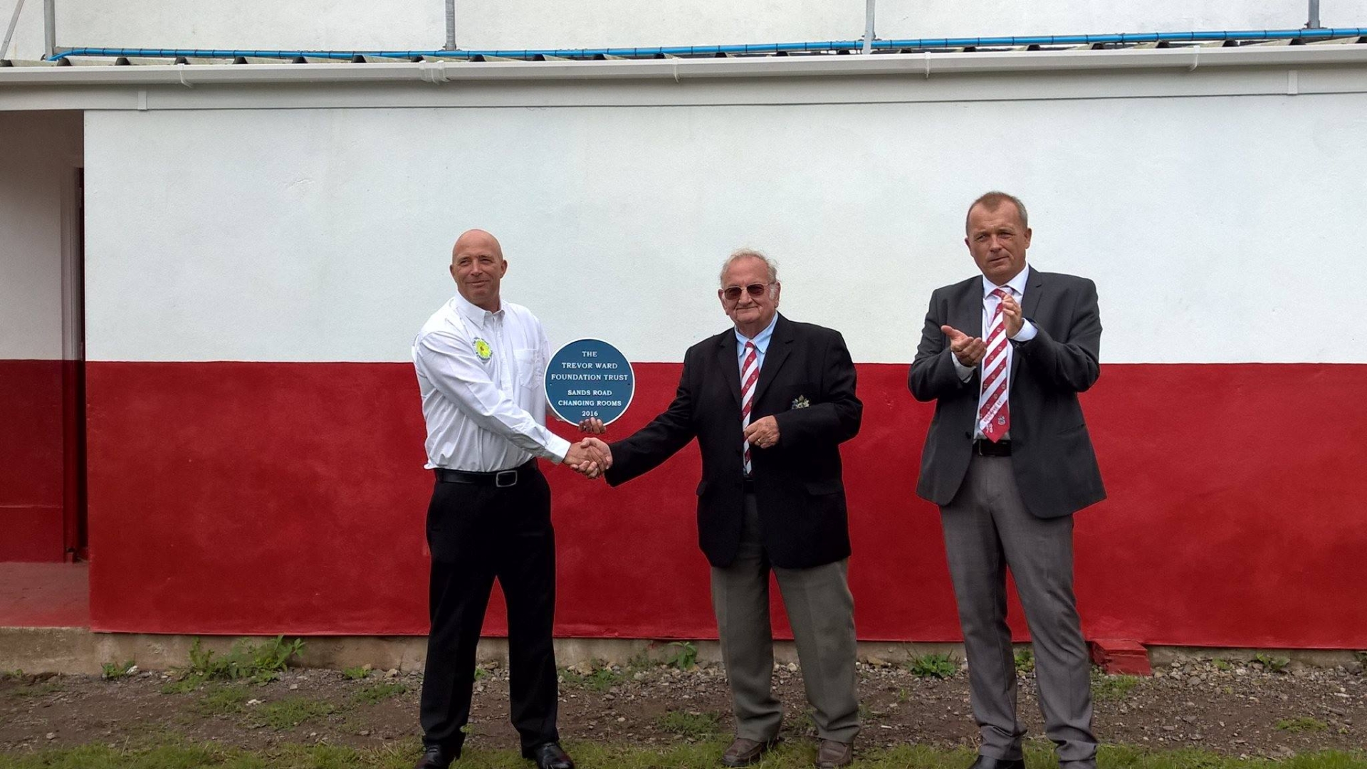 Tim Ward presenting Paignton Rugby Club with The Trevor Ward Foundation plaque. The Foundation provided funding towards the refurbishment of Sands Road changing rooms