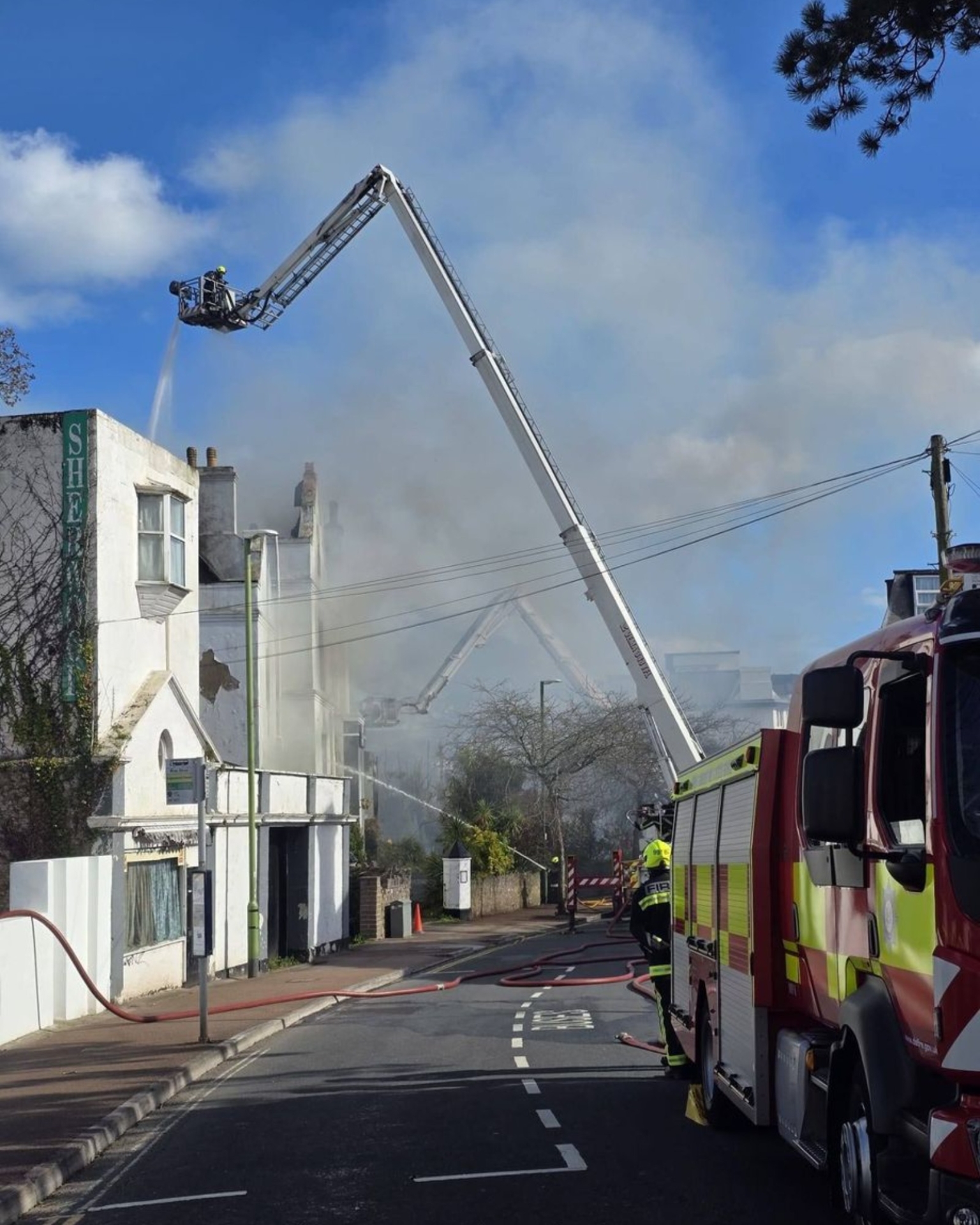 Sherwood Hotel blaze - a firefighter on the turntable ladder